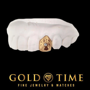 Single cap solitaire grill worn on model