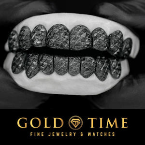 Black 16 piece perm cut grillz set with trillion diamond-cut texture on every tooth, top and bottom on a mold