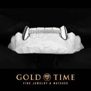 White gold 6 piece grillz with solid canine fangs and a moissanite row across the front teeth
