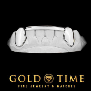 White gold 6 piece grillz with solid canine caps and a thin tip bar on a dental mold