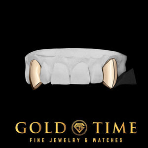 Rose gold 2 piece solid fang grillz on a dental model, shown on black with the Gold Time logo