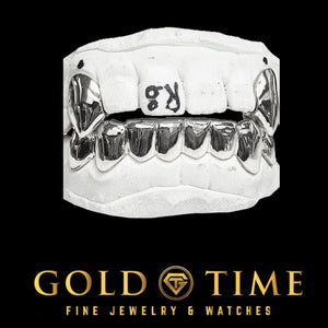 Silver 10 piece solid grillz set with canine fangs on top and bottom dental molds