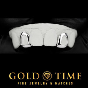Two white gold open face incisor caps joined by a bar behind the two front teeth, on a top dental mold