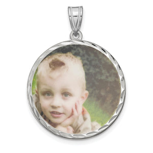Sterling silver round photo pendant with a child's photo inside a diamond-cut frame
