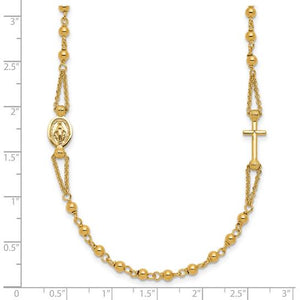 14K gold rosary necklace next to a ruler for scale