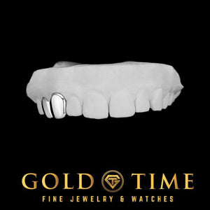 Angled view of the solid silver double cap grillz on a dental mold