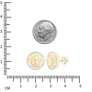Medusa diamond stud earrings beside a dime and a centimeter ruler for size