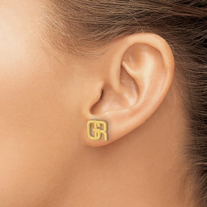 Ear wearing a yellow gold interlocking initial stud earring