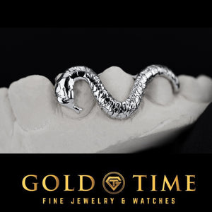 Close-up of a textured white snake grill on a dental mold