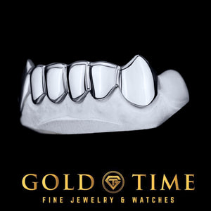 Angled view of white gold 6 piece solid fang grillz showing the individually shaped caps