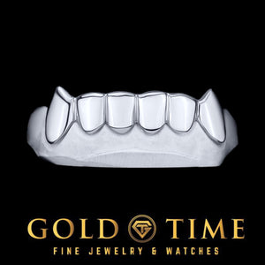 Front view of a white gold 6 piece solid grillz set with pointed fang canines