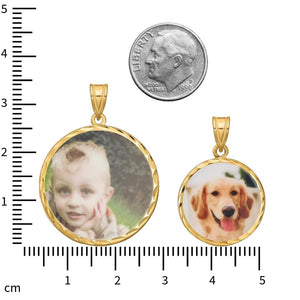 Large and small photo pendants beside a dime and a centimeter ruler, the small one showing a dog photo