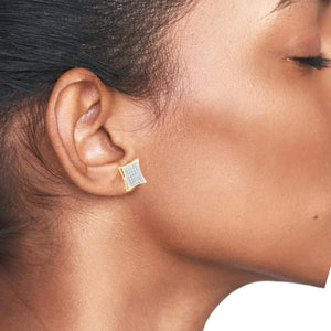 Woman wearing a yellow gold kite square diamond stud earring