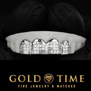 Four piece invisible set moissanite grillz on a dental mold, stones sitting flush with no visible prongs