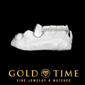 Angled view of 6 piece grillz with a polished canine fang and moissanite center row