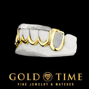 Angled view of the two tone 6 piece grillz showing the gold frame around the frosted front panels