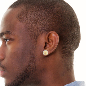 Ear wearing a 10K gold Medusa diamond stud earring