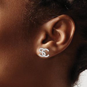 Ear wearing a white gold interlocking initial stud earring