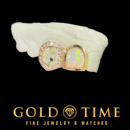 GoldTime Fine Jewelry & Watches logo with a gold grillz featuring opal and diamond stones on a black background