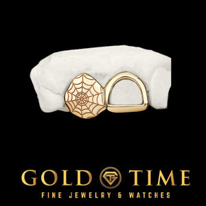 Custom double cap grillz with a spider web engraved gold cap next to an open face cap on a dental mold
