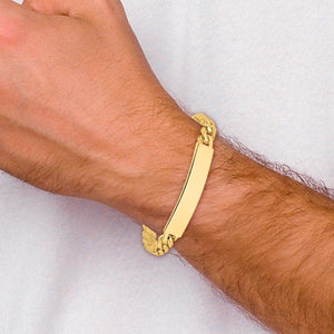 Man's wrist wearing the 14K yellow gold curb link ID bracelet