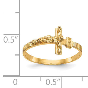 Gold ring with cross design on a white background with measurement scale