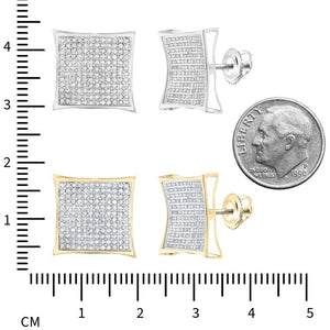 Kite stud earrings in yellow and white gold beside a ruler and a dime for scale