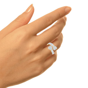 Hand wearing the white gold diamond bypass heart ring