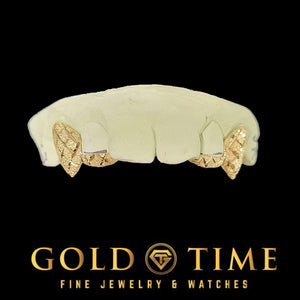Custom 4 piece gold fang grillz with trillion diamond cuts and diamond dust on a dental mold