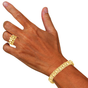 14K gold nugget bracelet worn on a wrist with a matching nugget ring