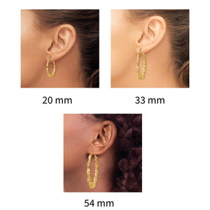 Bamboo hoop earrings worn in 20mm, 33mm, and 54mm sizes
