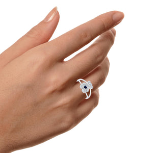Diamond teddy bear ring worn on a hand