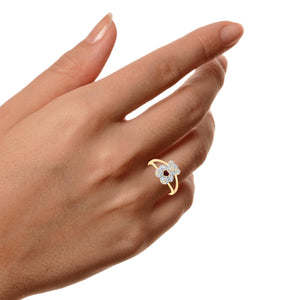 Hand wearing the 10K gold diamond and ruby teddy bear ring