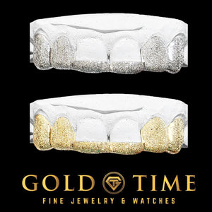 Two dental molds showing a six piece diamond dust tip grill, silver on the top set and yellow gold on the bottom