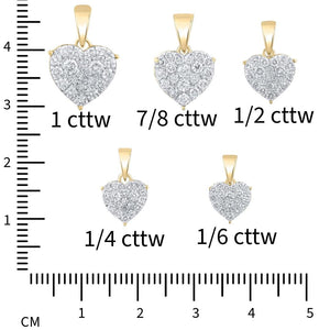 Size chart showing the diamond heart pendant in 1/6, 1/4, 1/2, 7/8 and 1 carat total weight against a ruler