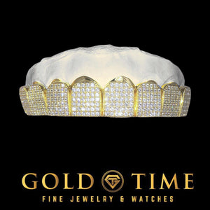 Six piece CZ block top grillz with pave stones framed in yellow gold on a dental model