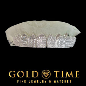 Rose plated silver CZ block grillz set with pave stones across every tooth