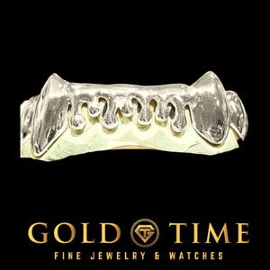 Custom 8 piece bottom drip grillz in white with pointed canine fangs and open melting drip shapes across the front teeth, on a dental mold