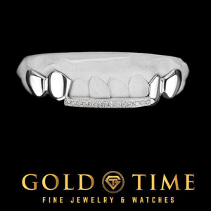 8 piece white metal top grill with solid outer teeth and a moissanite tip bar across the front teeth