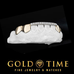 Angled view of a top grill with rose gold solid outer teeth and a white moissanite tip bar