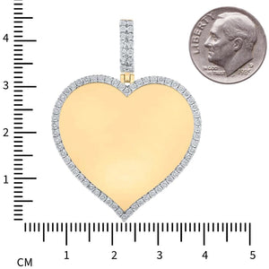 Yellow gold diamond heart pendant beside a dime and centimeter ruler, about 45mm tall including the bail