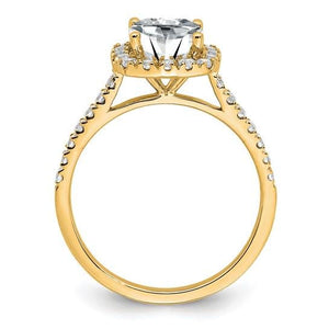 Side profile of a 14K yellow gold cushion moissanite halo engagement ring