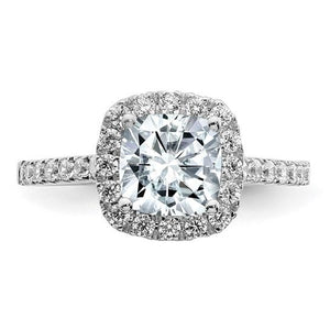 Front view of a 14K white gold cushion moissanite halo engagement ring