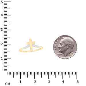 Yellow gold cross diamond ring next to a dime and centimeter ruler for size reference