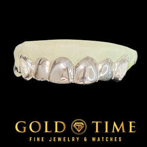 Front view of the silver 6 piece grillz showing polished fronts beside the frosted box canines