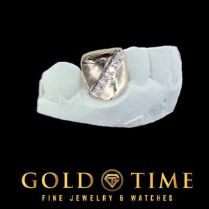 Silver single tooth cap with a diagonal moissanite row, shown on a dental mold
