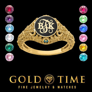 Yellow gold floral monogram ring with a black enamel face, raised three letter initials and a birthstone accent, shown with birthstone color options