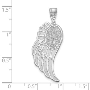 Sterling silver angel wing fingerprint pendant measured against a ruler, about an inch and a quarter tall