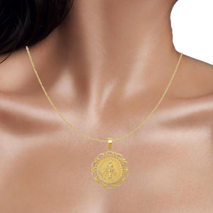 14k gold Miraculous Medal pendant worn on a thin gold chain at the neckline
