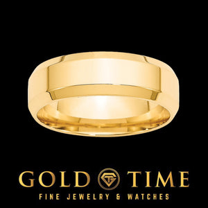 Yellow gold 7mm beveled edge wedding band shown at an angle